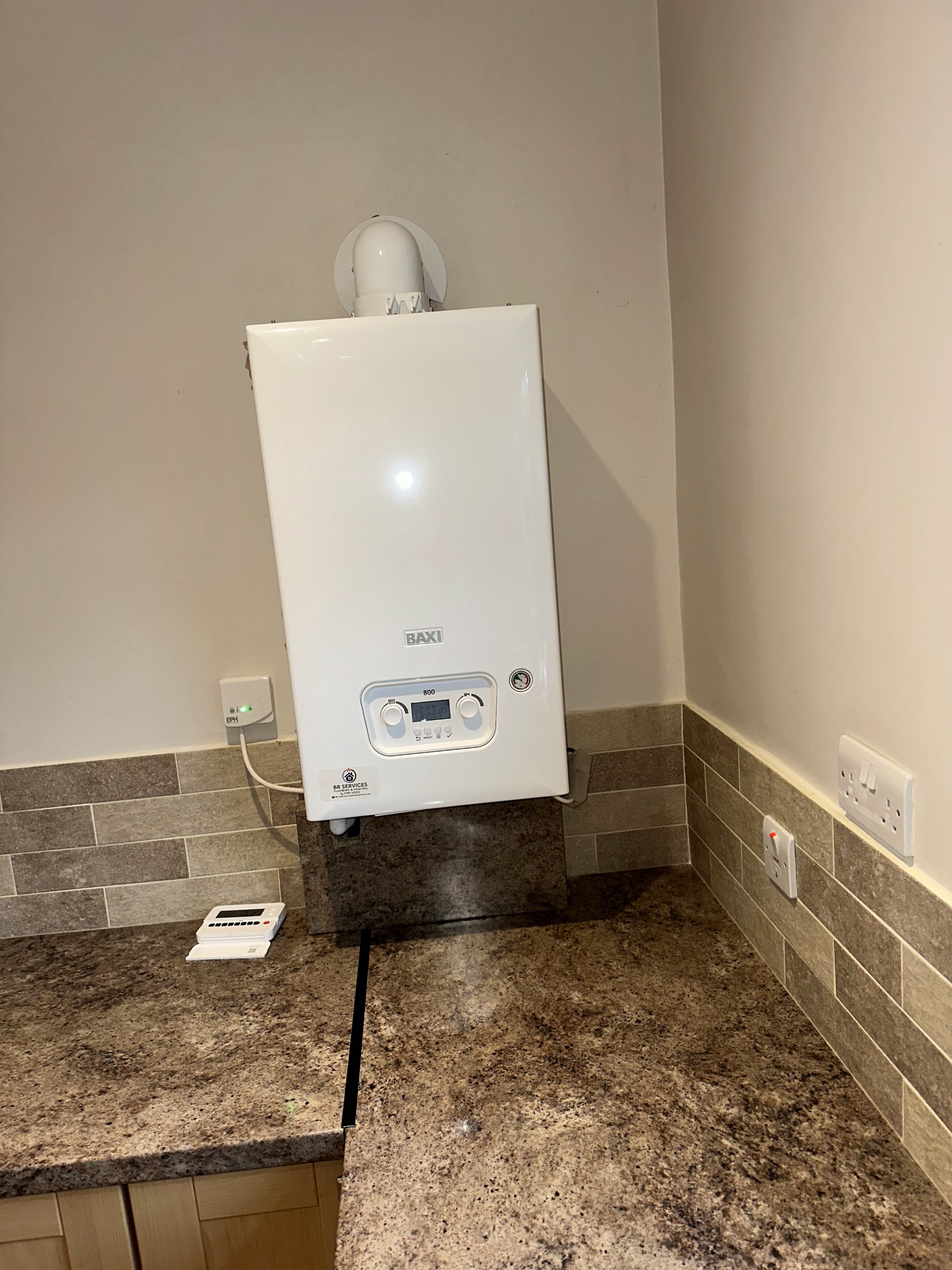 Baxi boiler installed in a kitchen, with a BR Services label