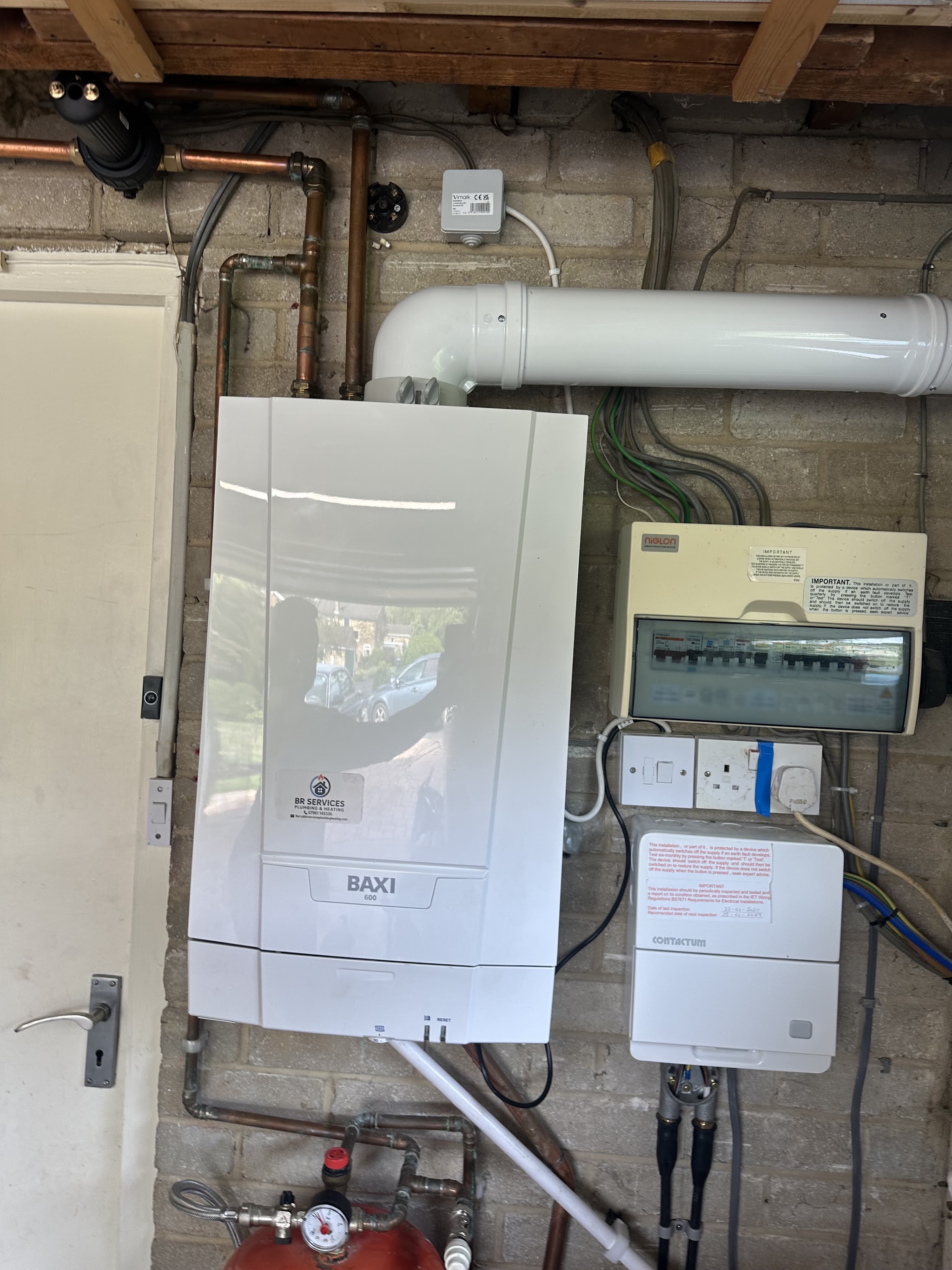 Wall-mounted Baxi boiler installation with a BR Services sticker